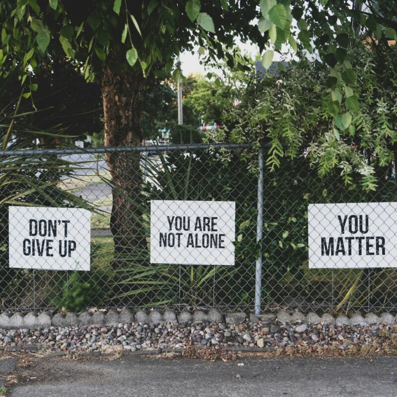 You are not alone poster in park