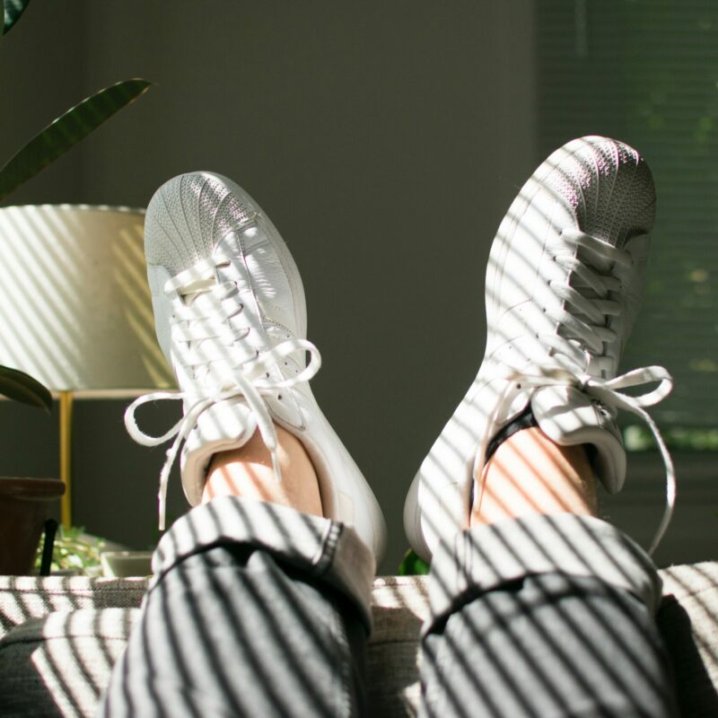 young woman in the comfort of her home with her feet up